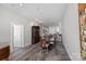 Spacious dining room with hardwood-style floors, elegant furniture, and ample natural light at 333 W Trade St # 2704, Charlotte, NC 28202
