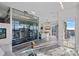 Bright home gym equipped with modern exercise equipment and city views at 333 W Trade St # 2704, Charlotte, NC 28202
