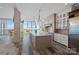 Modern kitchen showcasing a large island, stainless steel appliances, and city views at 333 W Trade St # 2704, Charlotte, NC 28202