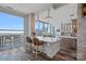 Modern kitchen boasts an island with seating and large windows providing city views at 333 W Trade St # 2704, Charlotte, NC 28202