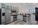 Modern kitchen with stainless steel appliances, granite countertops, and stylish cabinetry at 333 W Trade St # 2704, Charlotte, NC 28202