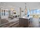 Bright open floor plan boasts hardwood floors, dining area, and a spacious kitchen with an oversized kitchen island at 333 W Trade St # 2704, Charlotte, NC 28202