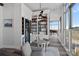 Cozy living area with a wine cooler, custom shelving and bright windows at 333 W Trade St # 2704, Charlotte, NC 28202