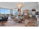 Elegant open-concept living and dining area featuring modern decor and stunning skyline views at 333 W Trade St # 2704, Charlotte, NC 28202