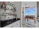 Modern wet bar featuring sleek granite countertops and ample storage at 333 W Trade St # 2704, Charlotte, NC 28202