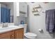 Charming bathroom with stylish vanity, modern fixtures, and decorative shelving at 3934 Blue Dory Ln, Denver, NC 28037