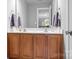 Bright bathroom with a double vanity, a large mirror, and ample storage at 3934 Blue Dory Ln, Denver, NC 28037
