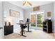 Well-lit home office featuring a large window and functional workspace at 3934 Blue Dory Ln, Denver, NC 28037