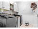 Well-organized laundry room with modern washer and dryer units at 3934 Blue Dory Ln, Denver, NC 28037