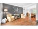 Spacious living room with hardwood floors and large open doorway at 3934 Blue Dory Ln, Denver, NC 28037