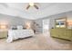Comfortable bedroom with a large bed, neutral tones, and a view into the ensuite bathroom at 3934 Blue Dory Ln, Denver, NC 28037