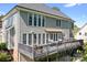 Rear exterior showcasing the spacious deck, multiple windows, and well-maintained backyard at 3934 Blue Dory Ln, Denver, NC 28037