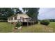 Well-maintained backyard with a spacious deck perfect for outdoor dining and relaxation at 403 Branch St, Kings Mountain, NC 28086