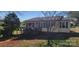 Charming yellow home with a quaint front porch and well-maintained lawn at 403 Branch St, Kings Mountain, NC 28086