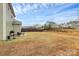 Enjoy outdoor living with this backyard setup featuring seating and a grill at 4213 Stockbrook Dr, Charlotte, NC 28215