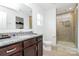 Stylish bathroom with a shower and a granite vanity at 4213 Stockbrook Dr, Charlotte, NC 28215