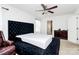 Spacious bedroom with a comfortable bed, ceiling fan, dresser, and window at 4213 Stockbrook Dr, Charlotte, NC 28215