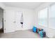Empty bedroom offering a blank canvas with ample natural light and closet space at 4213 Stockbrook Dr, Charlotte, NC 28215