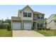 Charming two-story home featuring a two-car garage, neutral siding, and well-maintained landscaping at 4213 Stockbrook Dr, Charlotte, NC 28215