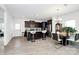 Modern kitchen featuring dark wood cabinets, a center island with seating, and stainless steel appliances at 4213 Stockbrook Dr, Charlotte, NC 28215