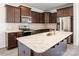 Modern kitchen features stainless steel appliances, marble countertops, and dark wood cabinetry at 4213 Stockbrook Dr, Charlotte, NC 28215