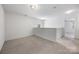 The neutral-toned loft offers a relaxing atmosphere with plenty of natural light at 4213 Stockbrook Dr, Charlotte, NC 28215