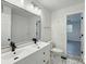 Charming bathroom with double sink vanity, updated fixtures, and modern patterned floor tiles at 4331 Hamilton Cir, Charlotte, NC 28216