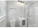 Clean bathroom with a glass shower, toilet, and vanity with storage at 4331 Hamilton Cir, Charlotte, NC 28216