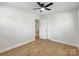 Bright bedroom with hardwood floors, ceiling fan, and closet at 4331 Hamilton Cir, Charlotte, NC 28216