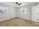 Simple bedroom with light-colored walls, hardwood floors, and a ceiling fan at 4331 Hamilton Cir, Charlotte, NC 28216