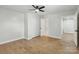 Neutral bedroom boasts a modern ceiling fan, wood-look floors, and a closet at 4331 Hamilton Cir, Charlotte, NC 28216
