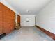 Attached carport with brick and vinyl siding, and stairs to a door at 4331 Hamilton Cir, Charlotte, NC 28216