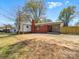 Back of property with vinyl and brick siding and a single car attached carport at 4331 Hamilton Cir, Charlotte, NC 28216