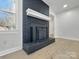 A detailed shot of the painted black brick fireplace with white mantel and hearth at 4331 Hamilton Cir, Charlotte, NC 28216