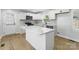Modern kitchen with an island, stainless steel appliances, and stylish backsplash at 4331 Hamilton Cir, Charlotte, NC 28216