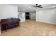 Open concept living room with hardwood flooring, fireplace, and a seamless flow to the kitchen at 4331 Hamilton Cir, Charlotte, NC 28216