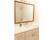 Updated bathroom boasts white vanity with gold faucet, large mirror, and subway tile shower at 4343 Dowling Dr, Charlotte, NC 28205