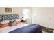 Cozy bedroom with a large window, soft lighting, and a blue floral headboard at 4343 Dowling Dr, Charlotte, NC 28205