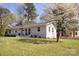 Charming single-story brick home with manicured front yard and blooming tree at 4343 Dowling Dr, Charlotte, NC 28205