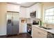 Beautiful, updated kitchen with stainless steel appliances, white cabinets and quartz countertops at 4343 Dowling Dr, Charlotte, NC 28205
