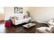 Bright living room features hardwood floors, neutral walls, stylish furniture and décor at 4343 Dowling Dr, Charlotte, NC 28205