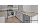 Modern kitchen featuring stainless steel appliances, granite countertops, and light gray cabinetry at 5152 Tommy Ln # 1303, Stanley, NC 28164