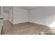 Spacious living area with luxury vinyl plank flooring and plenty of natural light at 5152 Tommy Ln # 1303, Stanley, NC 28164
