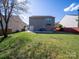 Large, private backyard featuring a spacious lawn and a patio area at 5670 Hammermill Dr, Harrisburg, NC 28075