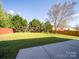 Green backyard with a well-maintained lawn, offering plenty of space at 5670 Hammermill Dr, Harrisburg, NC 28075