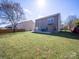 Spacious backyard with lush lawn, perfect for outdoor activities and relaxation at 5670 Hammermill Dr, Harrisburg, NC 28075
