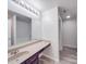 Bathroom featuring a vanity with sink, large mirror, and walk-in shower at 5670 Hammermill Dr, Harrisburg, NC 28075