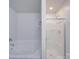 Bright bathroom featuring a soaking tub and a glass-enclosed shower at 5670 Hammermill Dr, Harrisburg, NC 28075