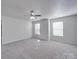 Bright bedroom with a ceiling fan, soft carpet, and natural light at 5670 Hammermill Dr, Harrisburg, NC 28075