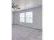 Spacious bedroom with carpet, ceiling fan, and double windows providing natural light at 5670 Hammermill Dr, Harrisburg, NC 28075